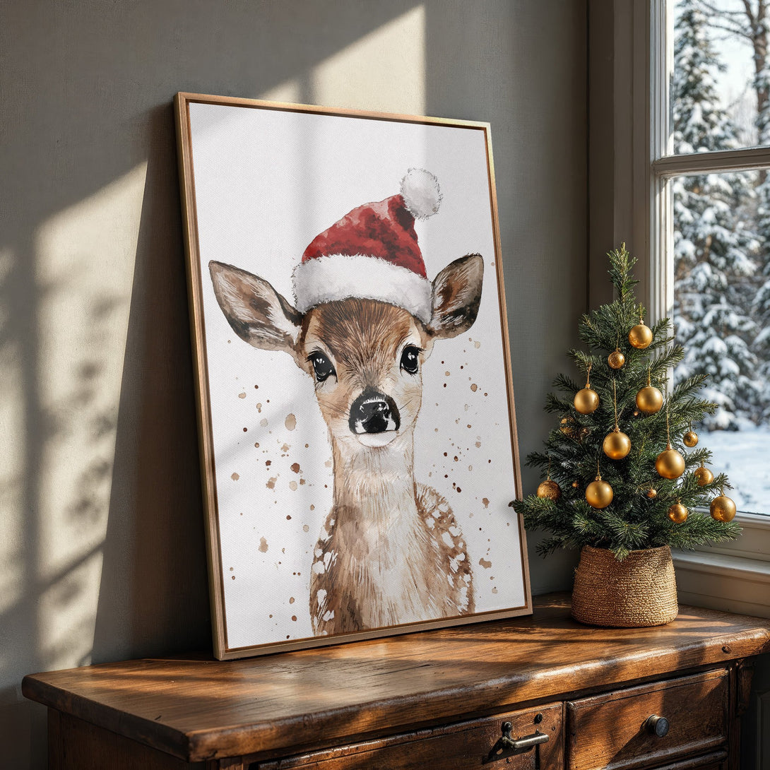 Framed Wall Art: Watercolor deer in Santa hat. Warm brown, red, and white color palette. Perfect Christmas decor for a cozy, festive home.