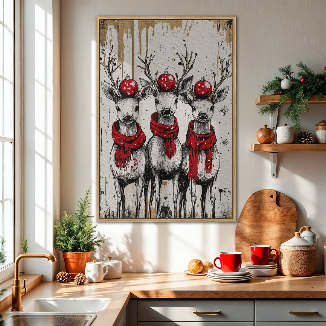 Framed Wall Art featuring three deer with red scarves and ornaments. Black and white illustration with a touch of red and gold, perfect for Christmas decor.