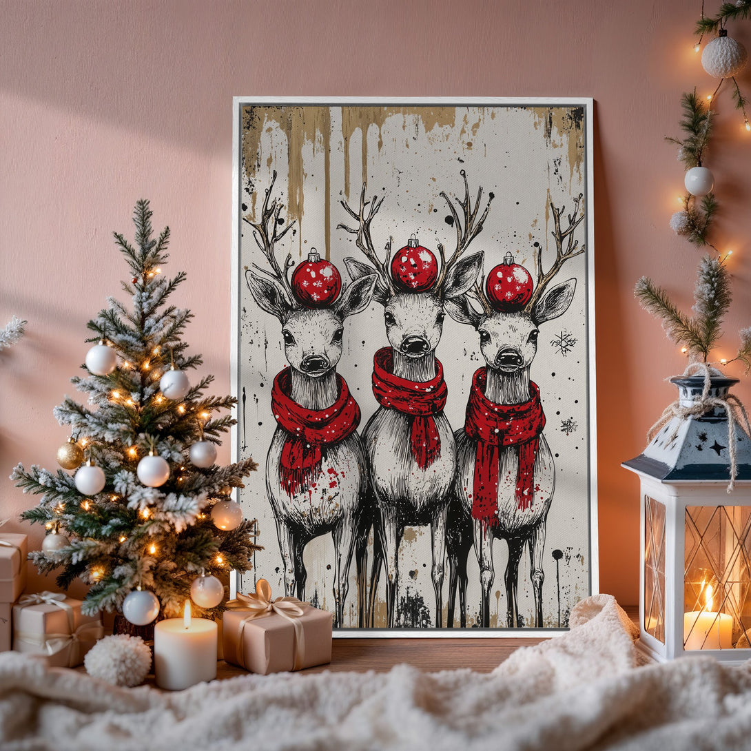 Framed Wall Art featuring festive reindeer with red scarves & ornaments. Black & white illustration with pops of red, perfect for Christmas decor.