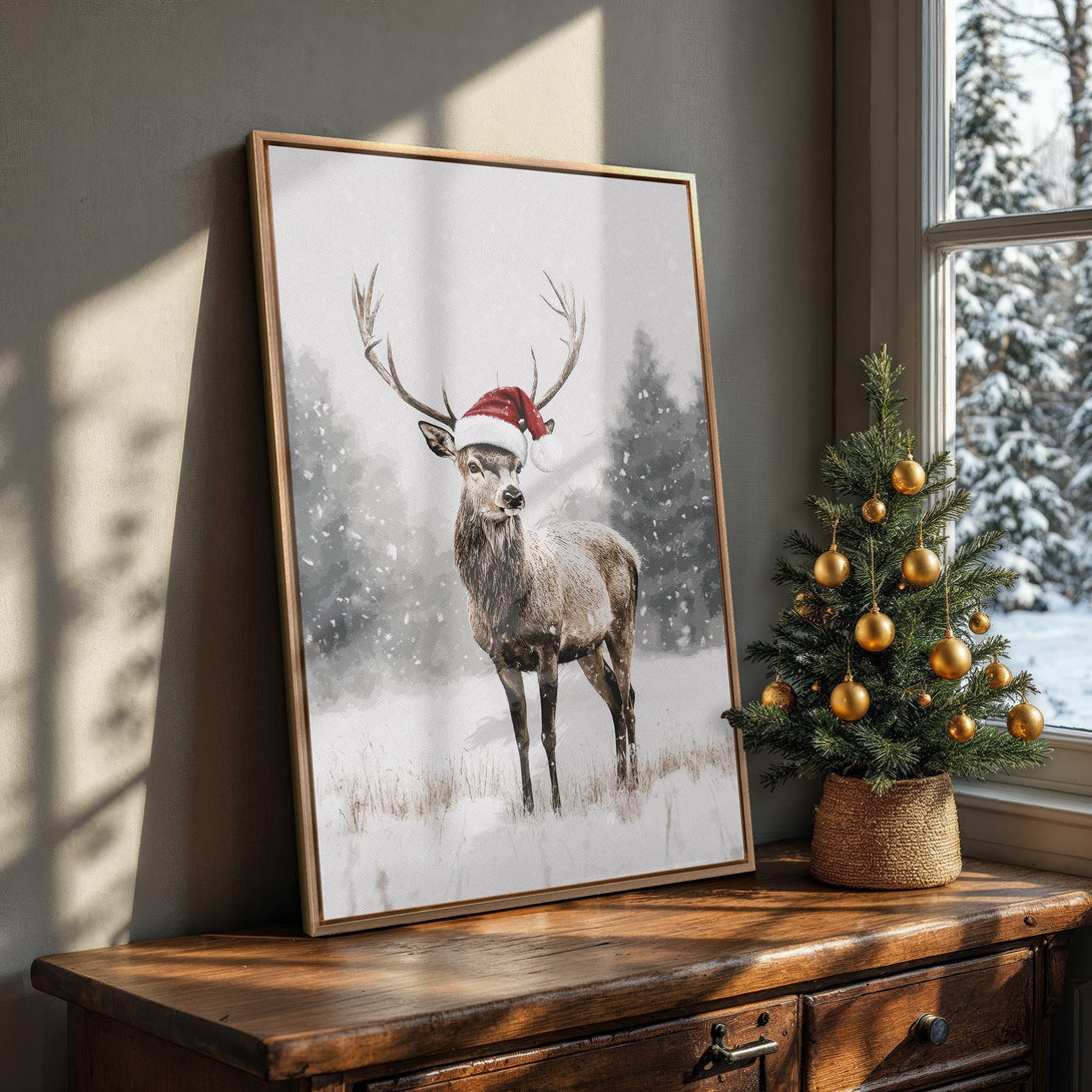 Framed Wall Art: Festive deer in a Santa hat. Watercolor style canvas print with a neutral, wintery color palette. Perfect Christmas decor!