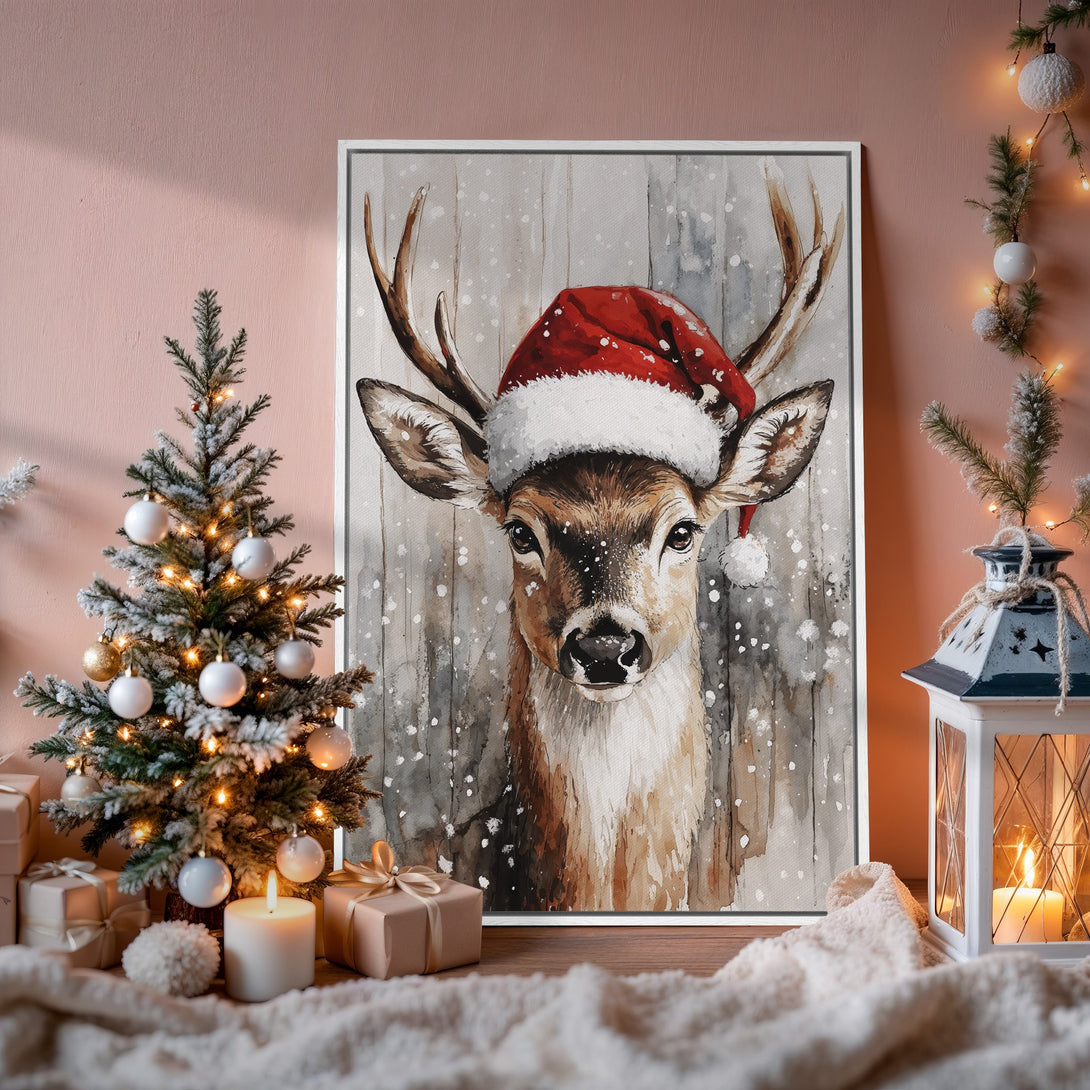 Framed Wall Art: Watercolor deer in Santa hat, rustic style, warm neutral palette. Perfect Christmas decor! Shop now for cozy holiday vibes.