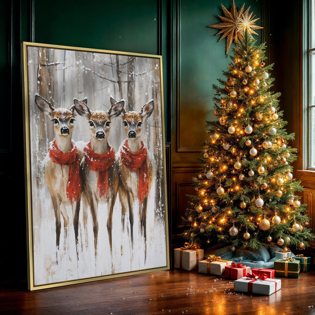 Canvas Print of three deer in a snowy forest, wearing red scarves. Rustic style art with a neutral and red color palette. Perfect winter wall decor.