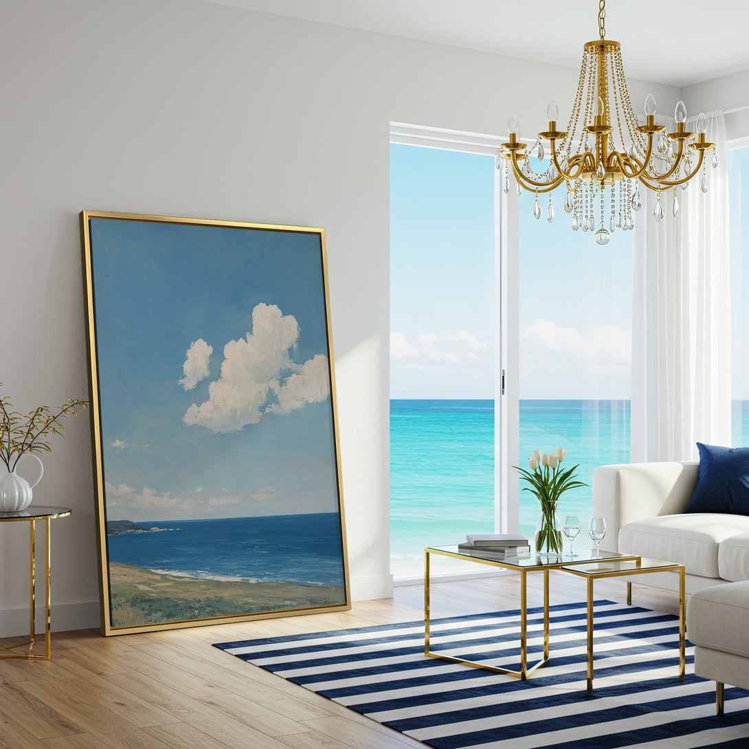 Canvas Print of a serene seascape painting with blue sky and white clouds. Coastal art in a modern living room with a calming blue and neutral palette.