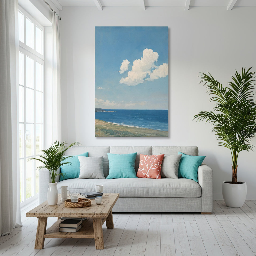 Framed Wall Art of a coastal landscape, featuring blue sky and sea, in a bright, airy interior. Coastal style, blue and gold color palette.