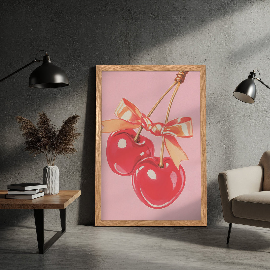 Framed Poster featuring vibrant red cherries with a bow, pop art style, set against a pink background. Perfect wall art!