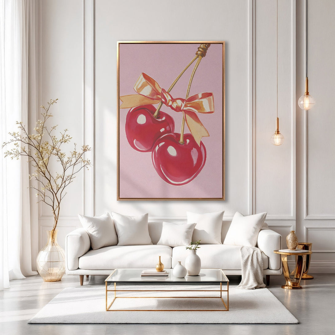 Framed Wall Art: Watercolor cherries with a gold bow, displayed in a modern living room. Pink, red, and gold color palette, perfect for adding a pop of color.