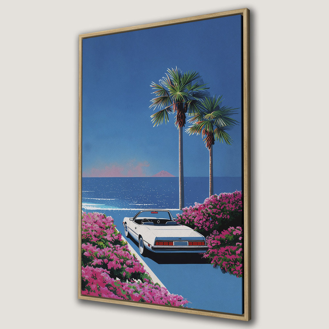 Framed Wall Art: Retro car on a coastal road with palm trees. Vibrant blue and pink color palette, perfect for adding a touch of vintage style to your space.