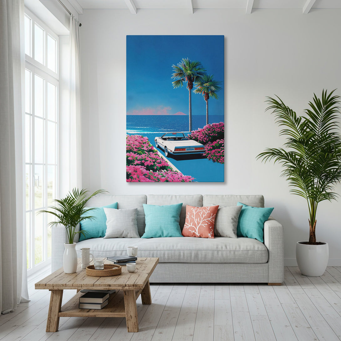 Framed Wall Art: Retro beach scene canvas print in a coastal interior, featuring a car, palm trees, and a blue and pink color palette.