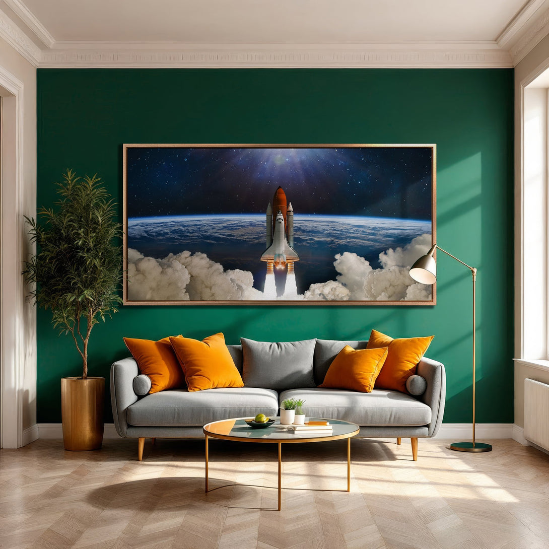 Framed Wall Art featuring a space shuttle launch over Earth. Modern, vibrant art with a teal, orange, and gray color palette. Perfect for living room decor.