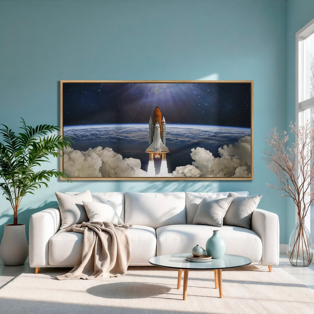 Framed Wall Art featuring a space shuttle launch. Dramatic art with a blue, white, and orange color palette, perfect for modern decor.