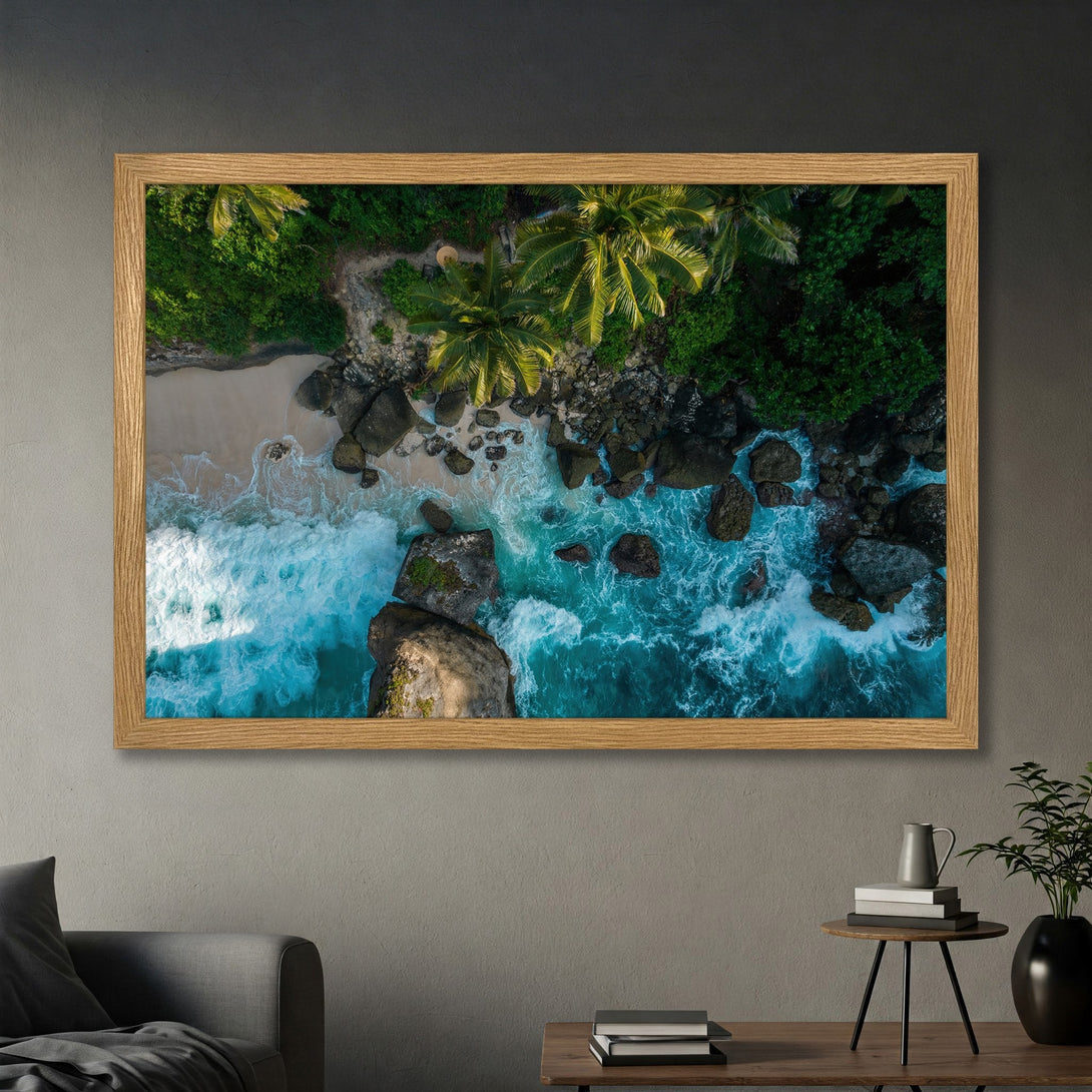 Framed Poster of a tropical beach with turquoise water and lush green foliage. Coastal landscape art in a natural color palette.