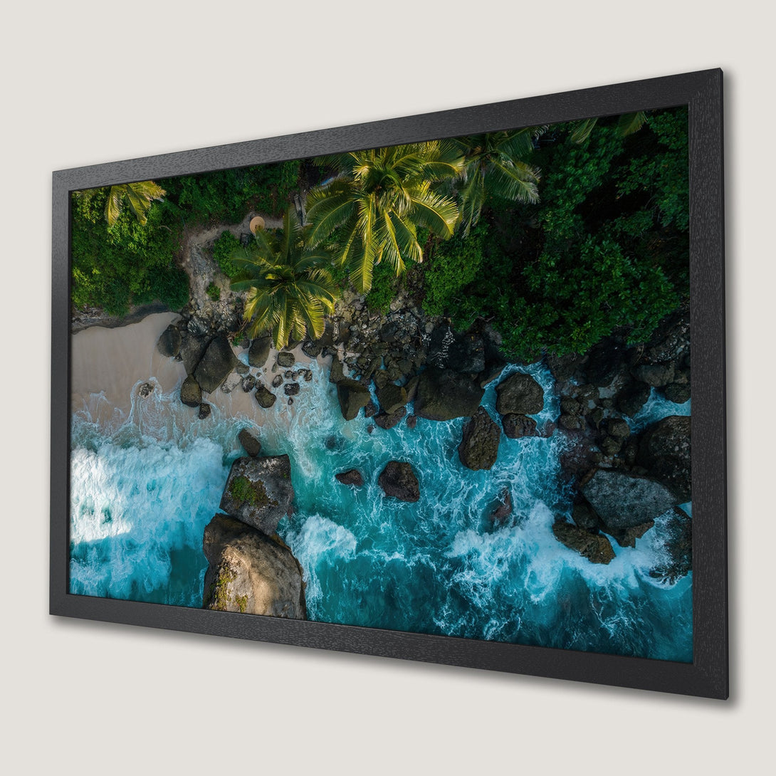 Framed Poster of a tropical beach scene with turquoise water, green palm trees, and a dramatic, aerial view. Coastal decor.