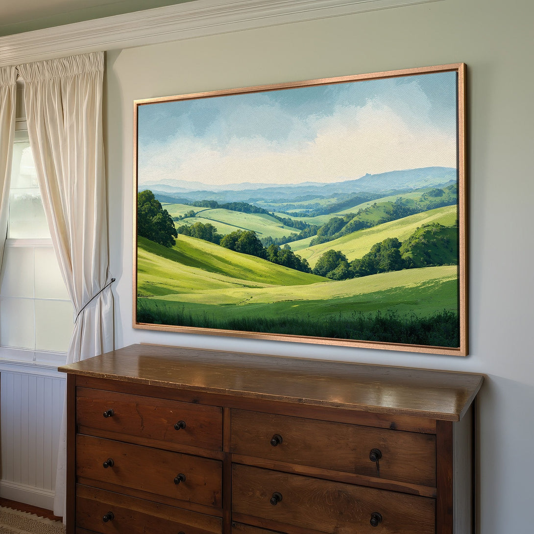 Framed Wall Art of a serene landscape with rolling green hills, blue skies, and a warm color palette. Perfect for adding a touch of nature to your home.