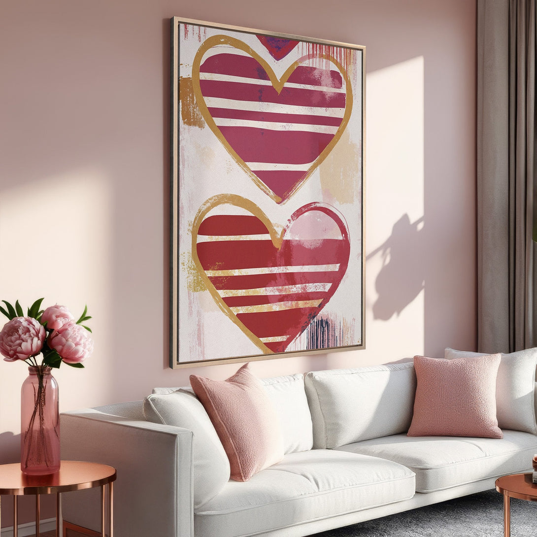 Framed Wall Art: Abstract heart art in red & gold. Modern canvas print adds a pop of color to any space. Soft pink palette for a cozy, stylish look.