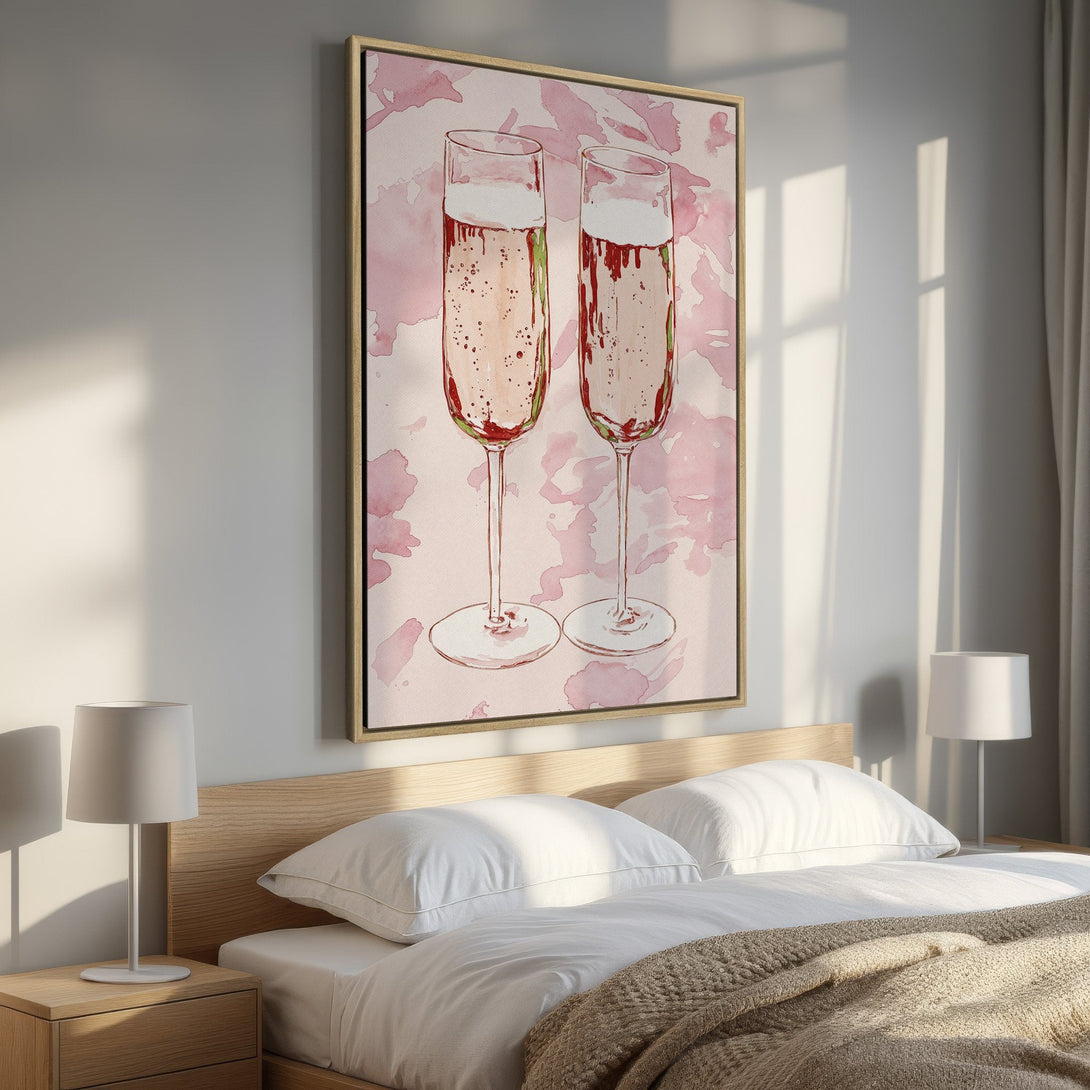 Framed Wall Art featuring two champagne glasses in a watercolor style, with a soft pink and red color palette. Perfect for bedroom decor.