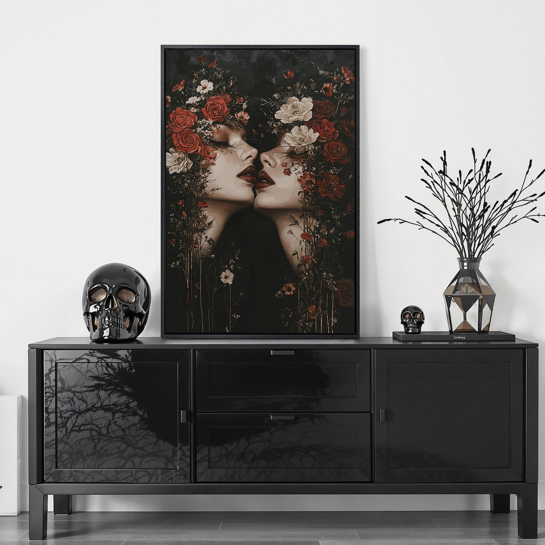 Framed Wall Art featuring a gothic-style portrait of two women with red floral accents. Dark, moody color palette perfect for adding drama to your space.