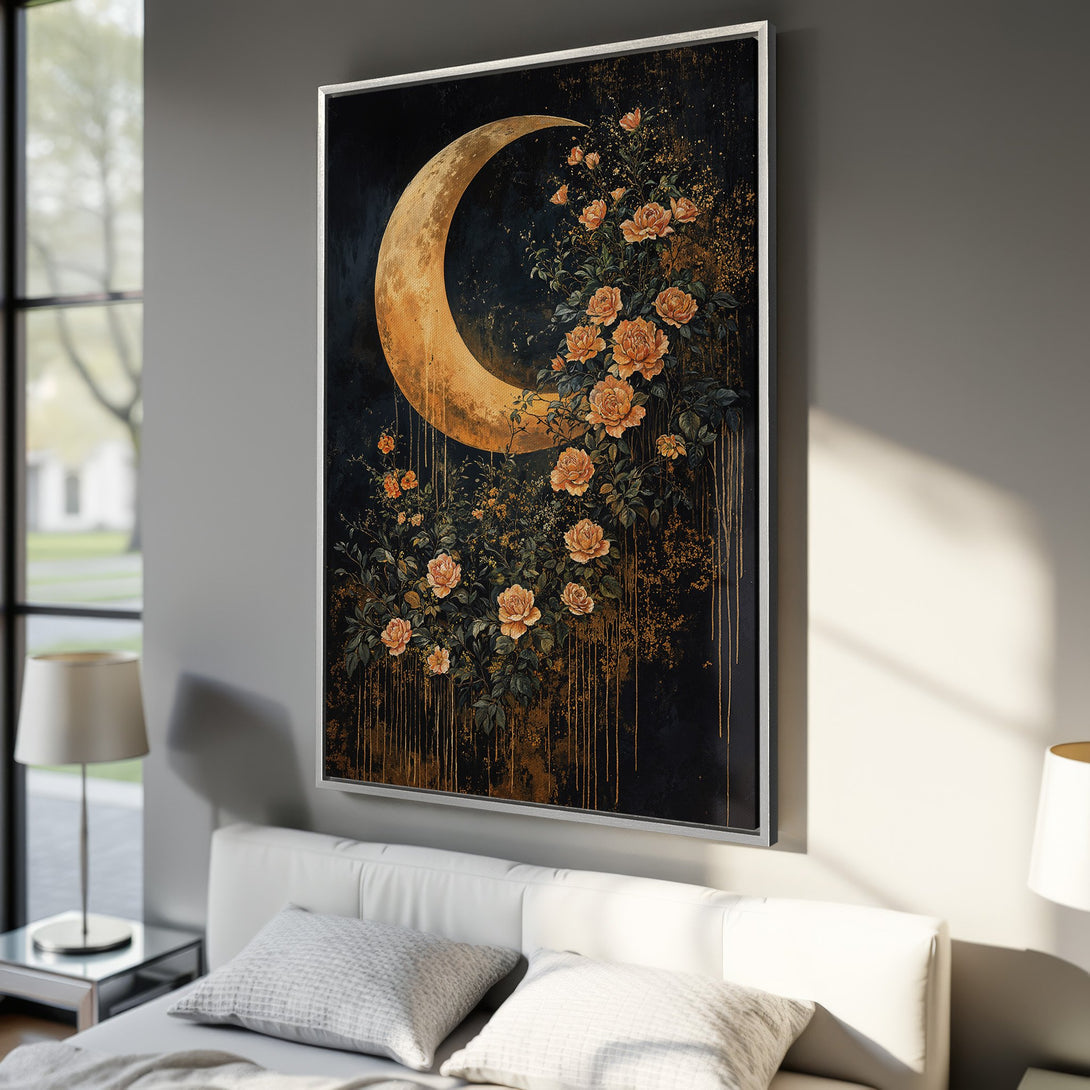 Framed Wall Art: Celestial moon and rose canvas print in a bedroom. Dark, moody art with gold, black, and peach tones. Perfect for modern home decor.