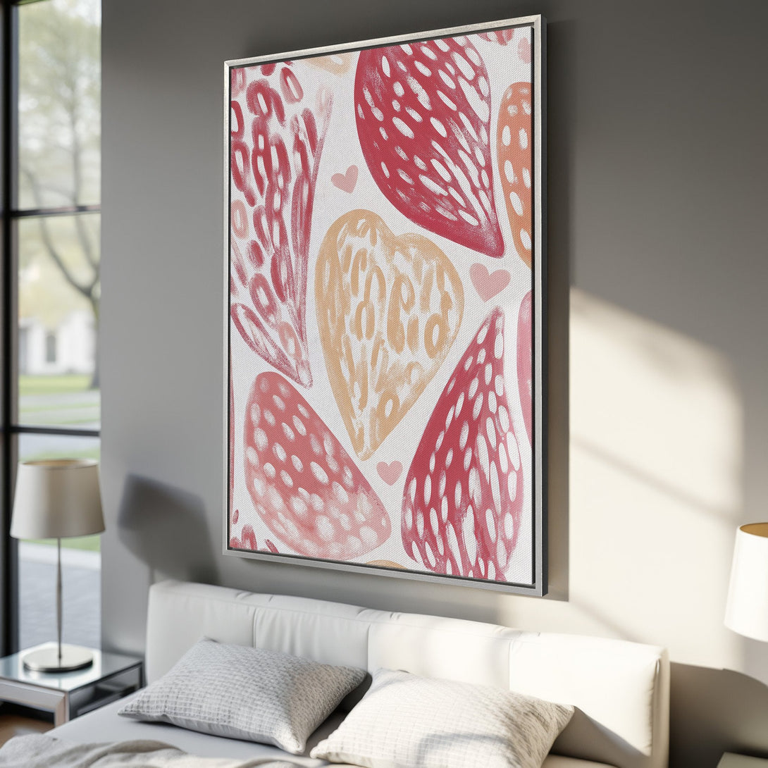 Framed Wall Art featuring abstract heart design in red, pink, and peach. Modern art print for bedroom decor.