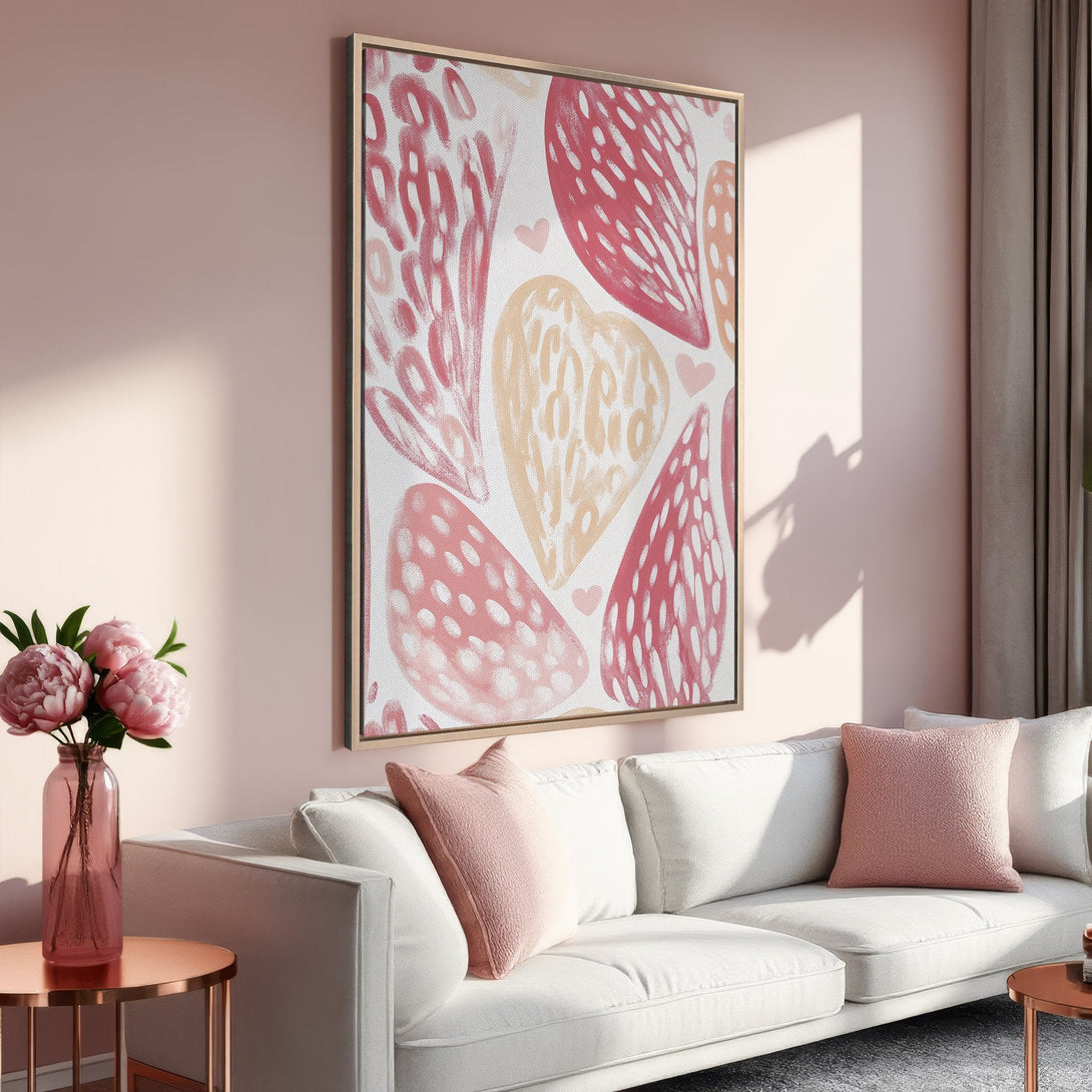 Framed Wall Art featuring abstract heart design in a blush and peach color palette. Perfect for adding a touch of modern art to your living room!