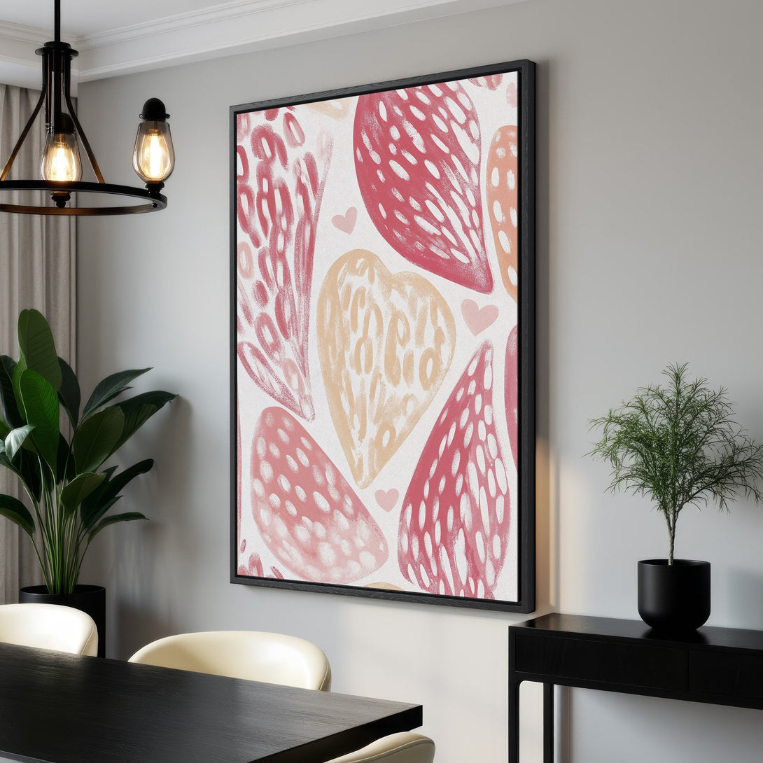 Framed Wall Art featuring abstract heart design in pink and peach hues. Modern canvas print adds a pop of color and style to any interior.