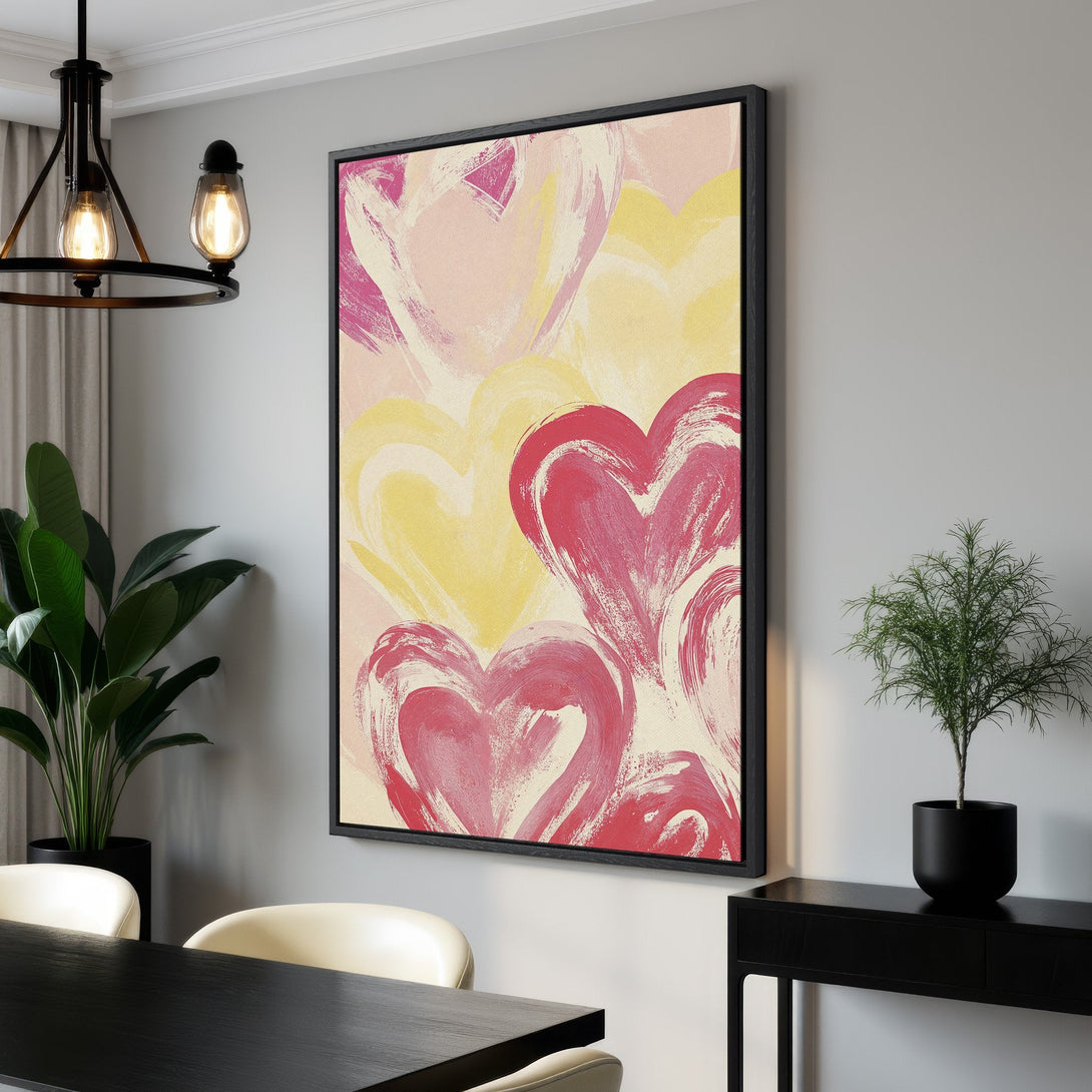 Framed Wall Art featuring abstract hearts in pink and yellow hues. Modern art perfect for adding a pop of color to any interior space. Shop our Canvas Print collection!