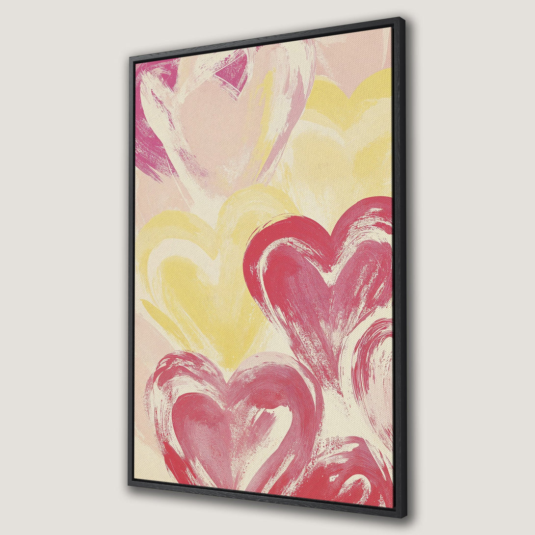 Framed Wall Art featuring abstract hearts in pink and yellow hues. Modern, expressive artwork for a stylish home.