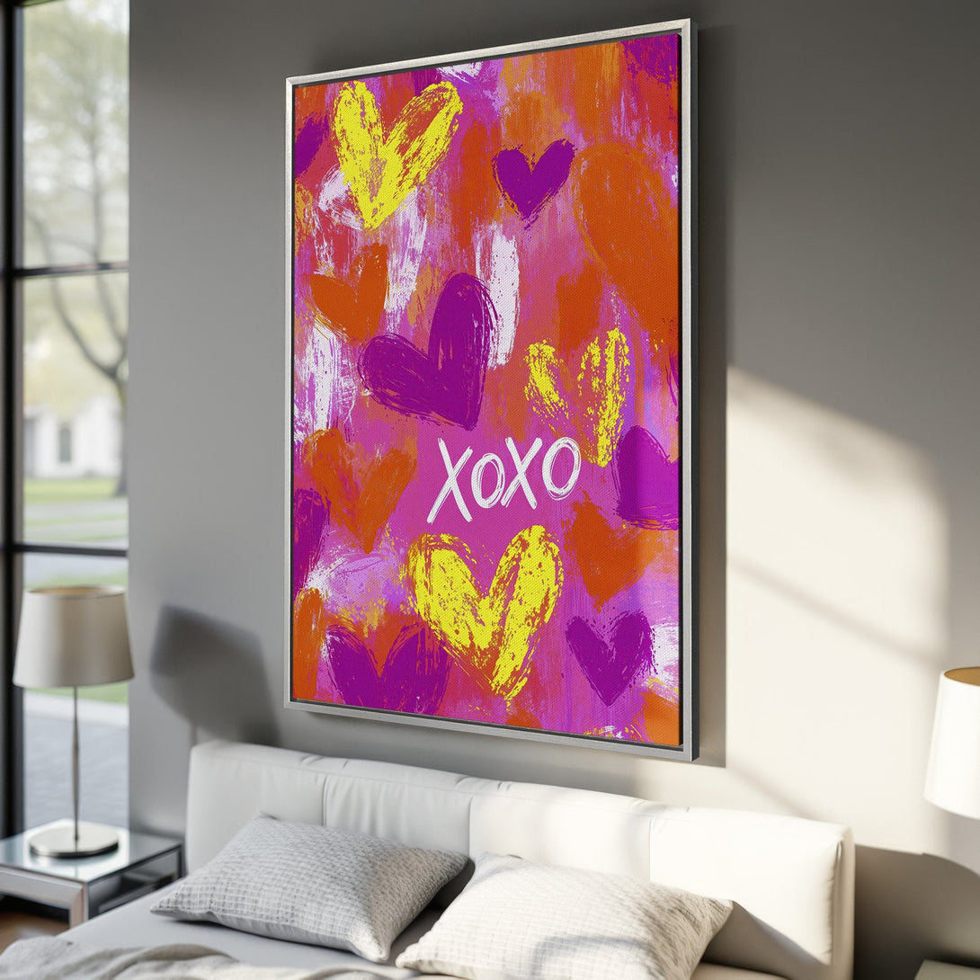Framed Wall Art featuring an abstract heart design in vibrant pink, orange, and yellow hues. Perfect for adding a pop of color to any room!