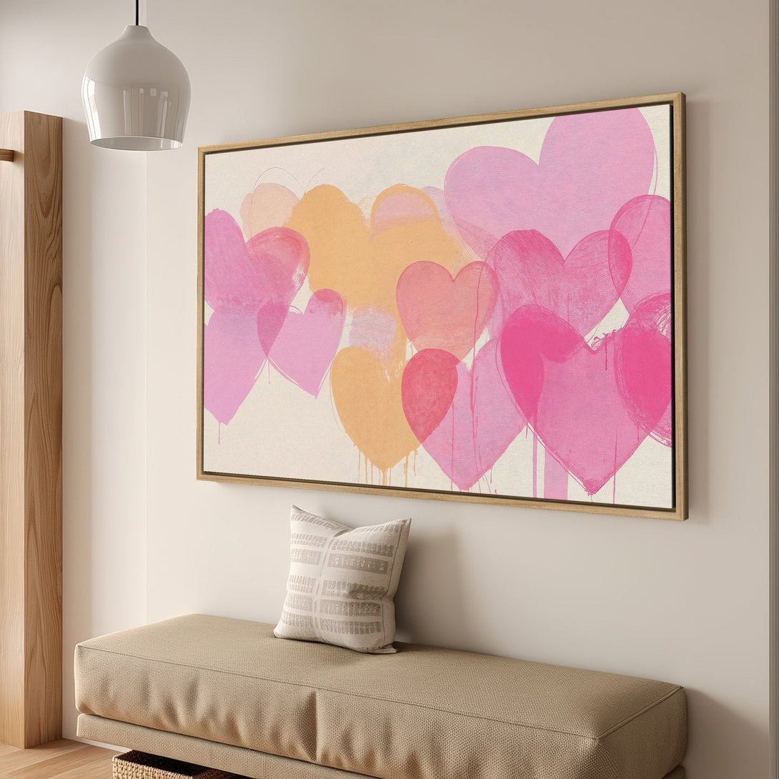 Framed Wall Art featuring a vibrant, abstract heart design in pink and peach hues, perfect for adding a pop of color to your space.