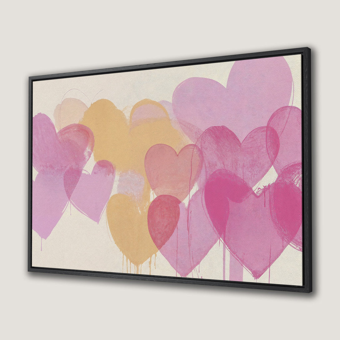 Framed Wall Art featuring abstract hearts in a pink and yellow color palette. Modern art perfect for adding a touch of love to any space.