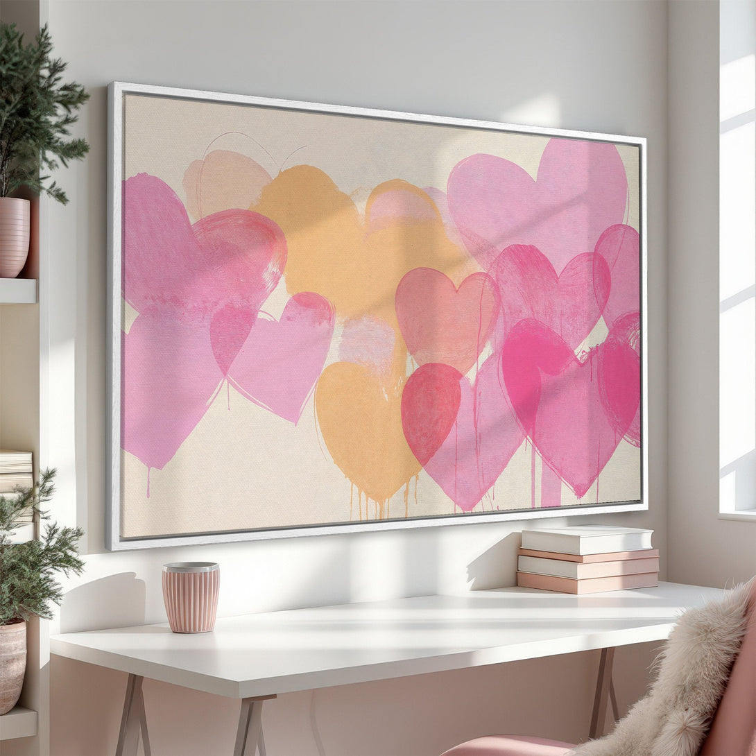 Framed Wall Art featuring a vibrant heart design in pink and peach hues. Modern, romantic canvas print perfect for adding a pop of color to any space.