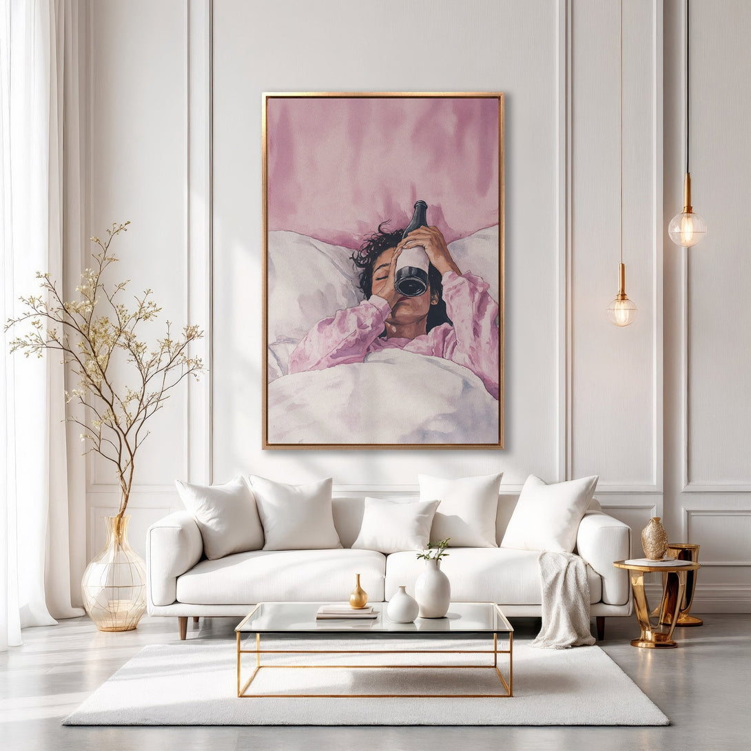 Framed Wall Art: Watercolor painting of a woman in bed with a wine bottle, displayed in a modern living room with a pink and white color palette.