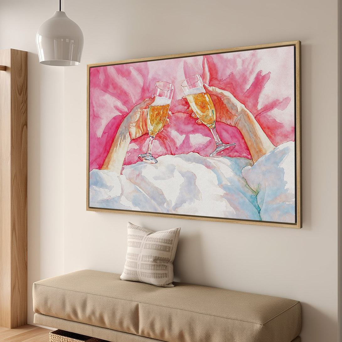 Framed Wall Art featuring a watercolor painting of champagne glasses clinking, in a pink and gold color palette. Perfect for adding a touch of elegance.