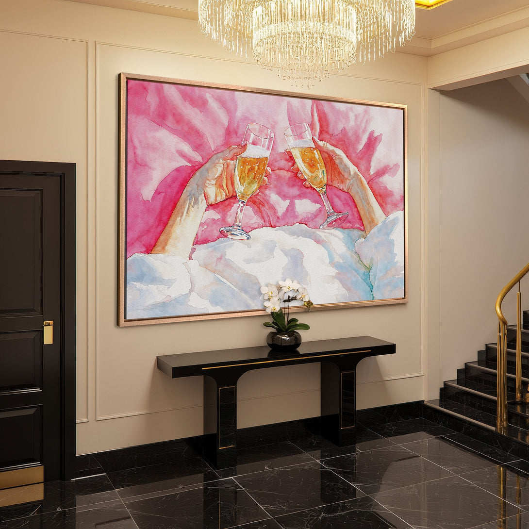 Framed Wall Art of champagne toast in watercolor style, featuring a pink and gold color palette. Perfect for adding a touch of elegance to your home decor.