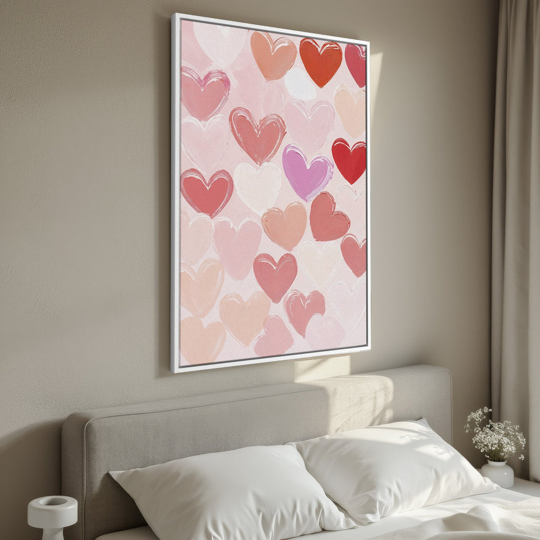 Framed Wall Art: Abstract heart painting in a bedroom. Romantic art with a pink, red, and peach color palette. Perfect Valentine's Day gift.