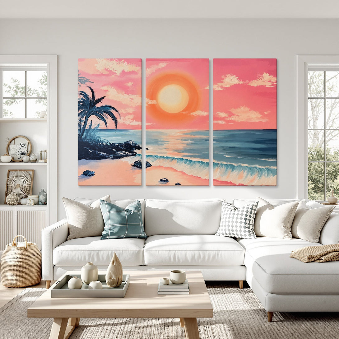 Canvas Print triptych of a beach sunset in a living room. Features a vibrant pink, orange, and blue color palette. Coastal art for your home!