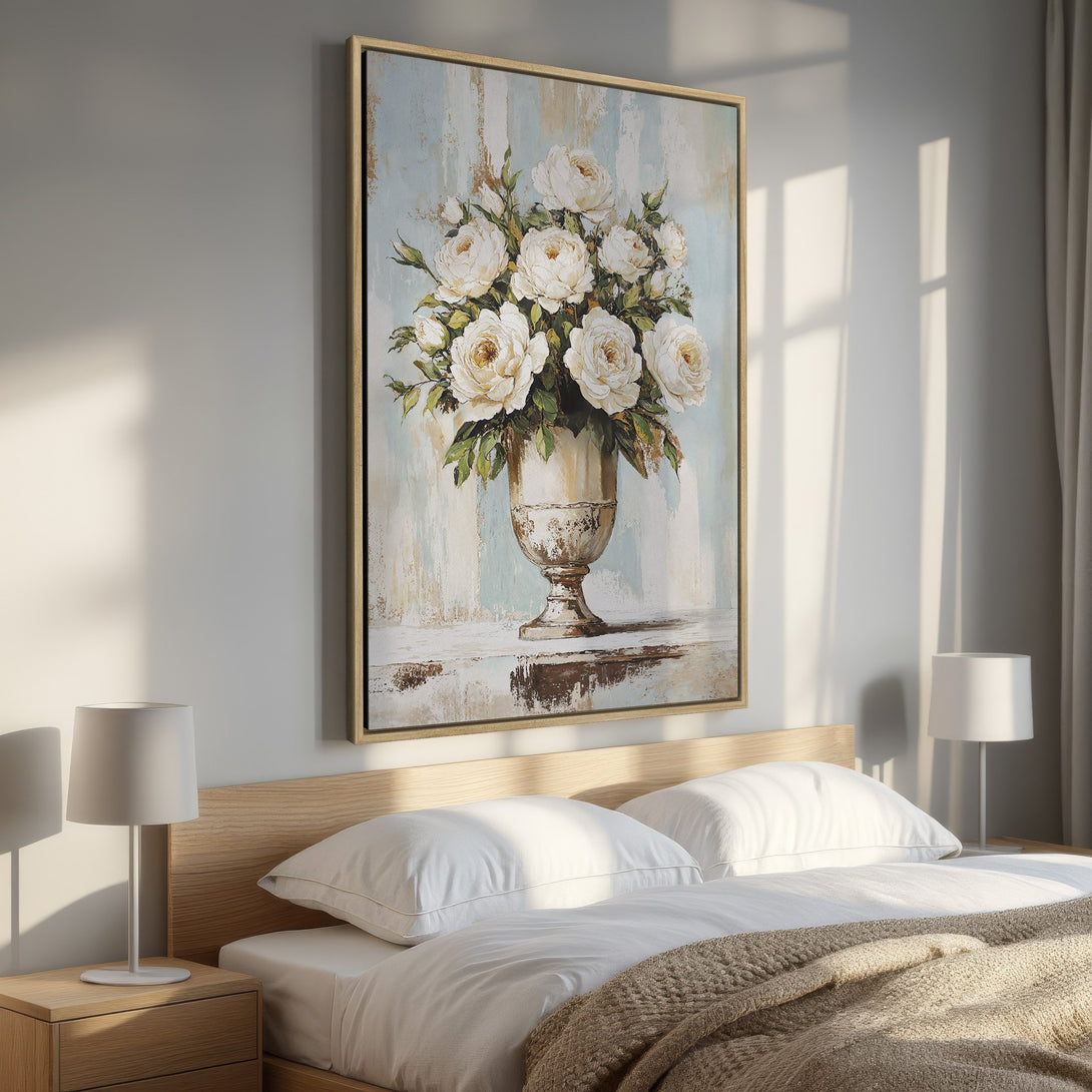 Framed Wall Art: Elegant floral Canvas Print with white roses in a vase, displayed in a bedroom. Soft, neutral color palette for a serene aesthetic.