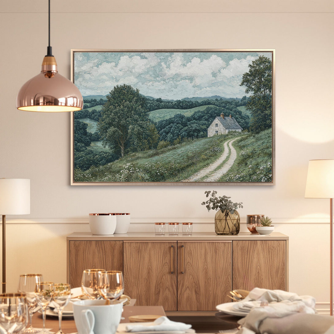 Framed Wall Art: Serene landscape Canvas Print, featuring a charming cottage and rolling hills in a calming green and blue palette. Elevate your space!