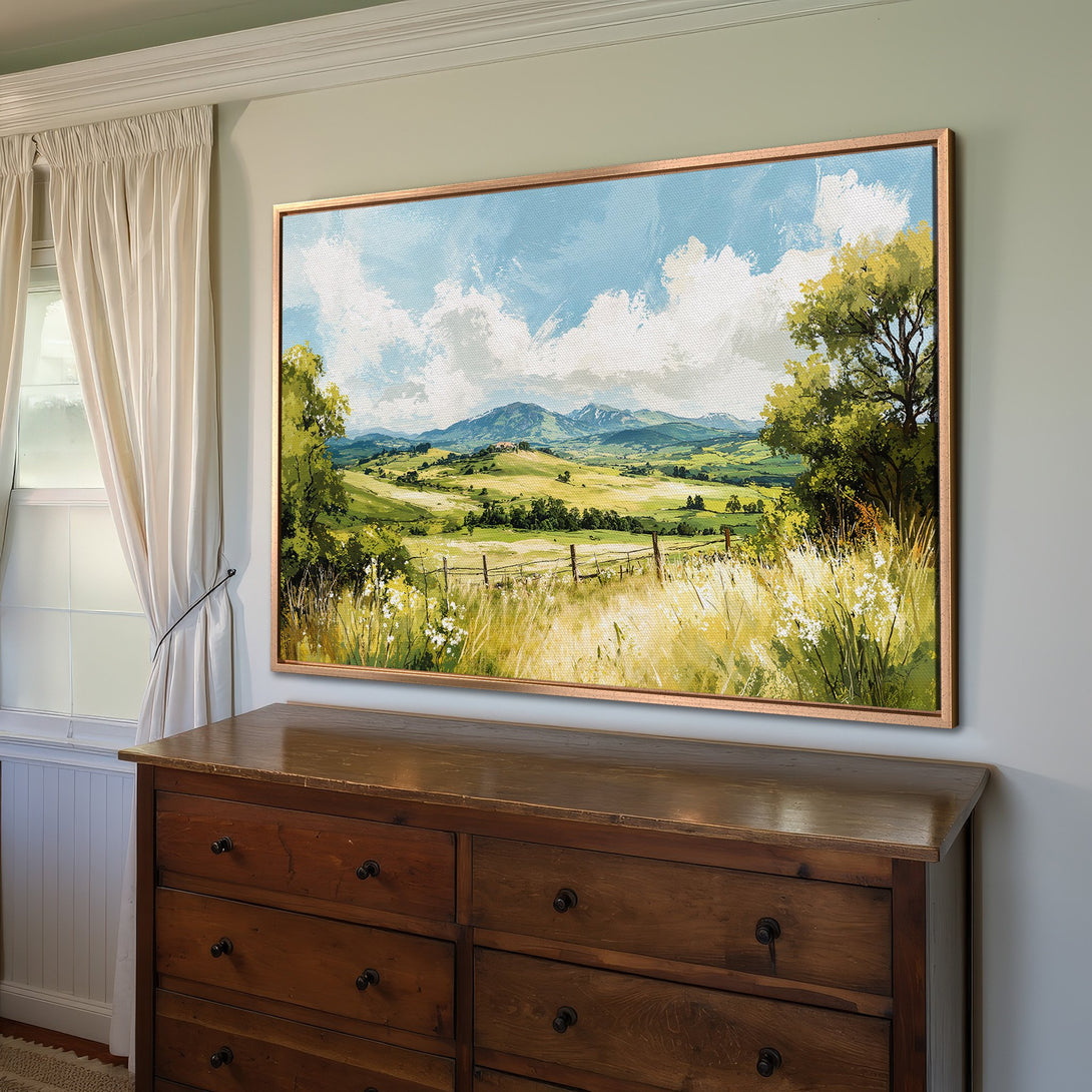 Framed Wall Art: Landscape Canvas Print with a serene countryside scene in green, blue, and yellow tones. Perfect for adding a touch of nature to your home decor.