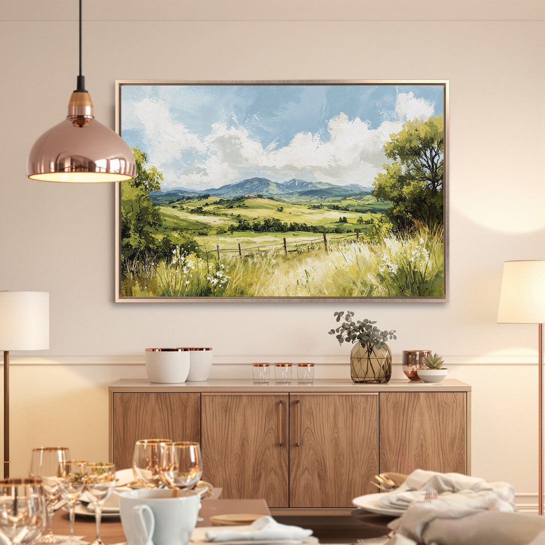 Framed Wall Art: Landscape painting with green fields, blue sky, and mountains. Beautiful canvas print with a warm, natural color palette. Perfect home decor.