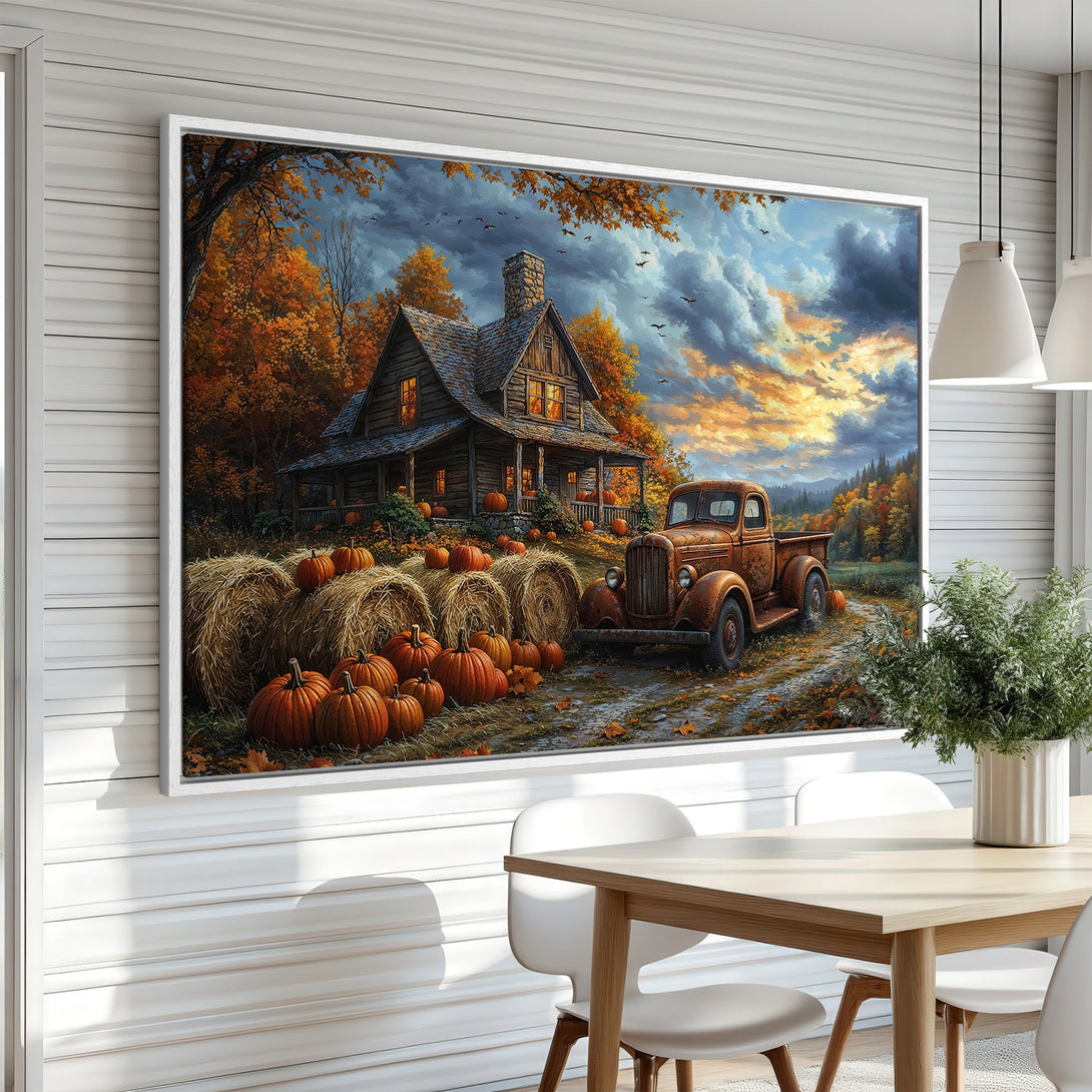 Framed Wall Art Canvas Print of a rustic autumn scene with a cabin, truck, and pumpkins. Warm orange and brown color palette.