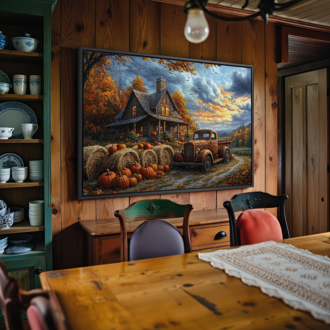 Framed Wall Art: Autumn scene with cabin, truck, and pumpkins. Warm orange, brown, and gold color palette. Rustic style for cozy home decor.