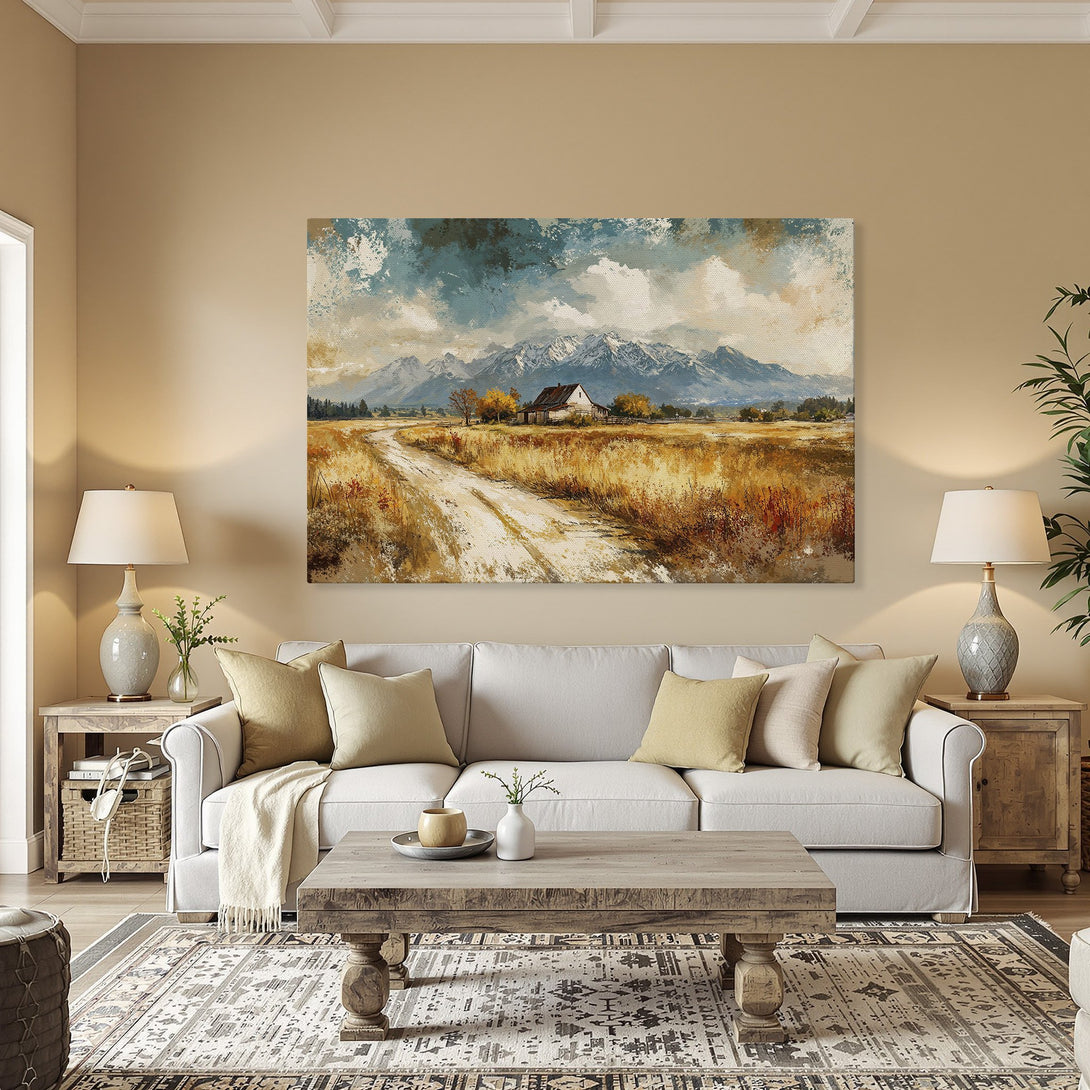 Framed Wall Art of a rustic landscape painting with mountains and a farmhouse. Earthy tones of gold, blue, and brown. Perfect for home decor.