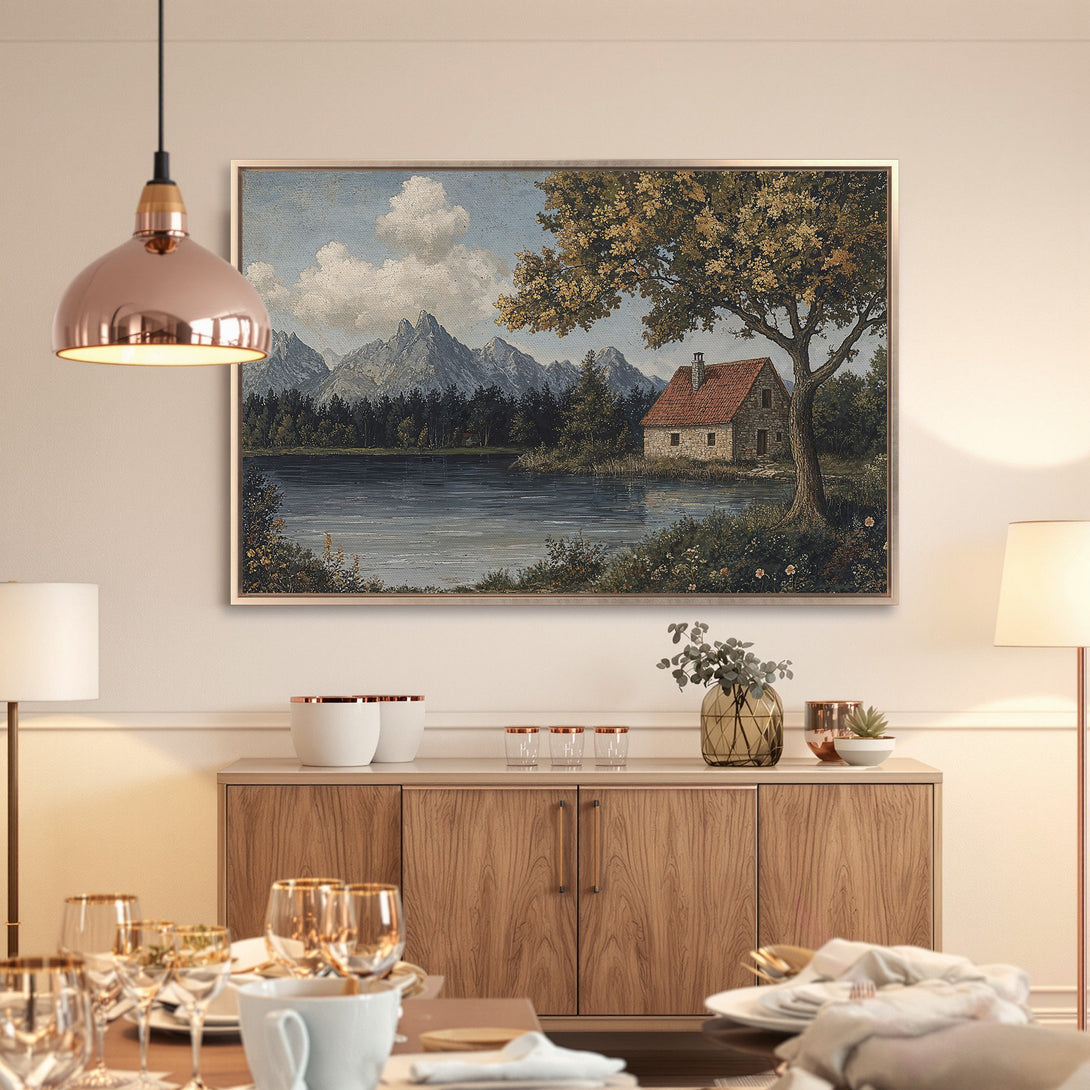 Framed Wall Art: Scenic landscape Canvas Print with a cabin, mountains, and lake, in a vintage style with muted blues, greens, and earth tones.