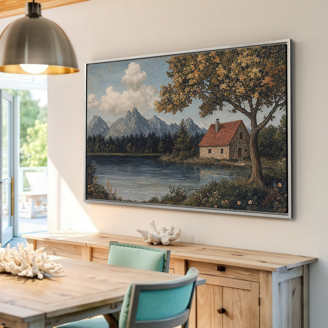 Framed Wall Art: Scenic landscape Canvas Print with a charming cottage, mountains, and lake. Earthy tones create a cozy, classic interior aesthetic.