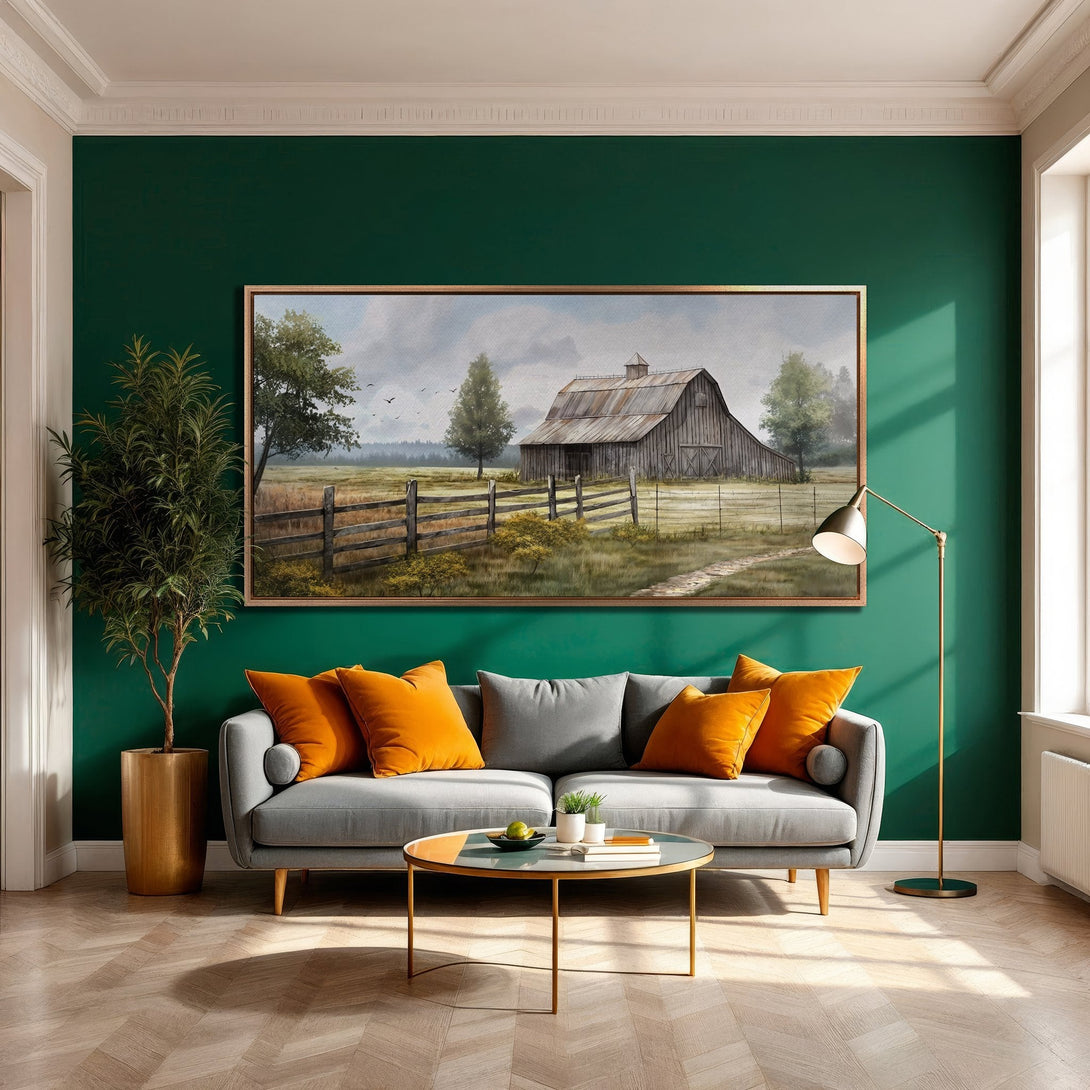 Framed Wall Art: Rustic barn landscape canvas print in neutral tones, adding warmth to a modern living room with green accent wall.