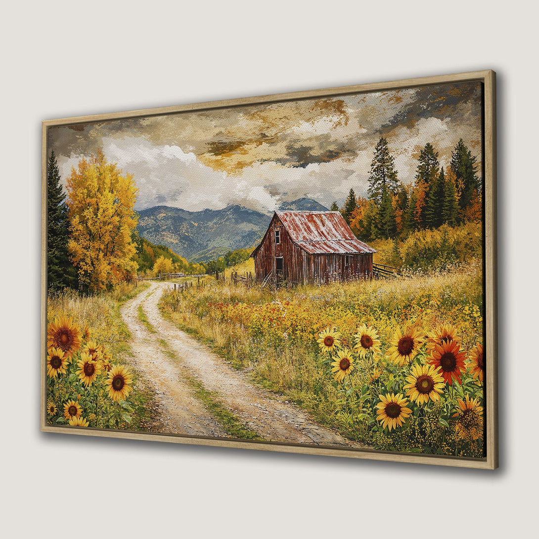Framed Wall Art: Rustic landscape Canvas Print featuring a barn, sunflowers, and a dirt road. Warm, autumnal color palette for cozy home decor.