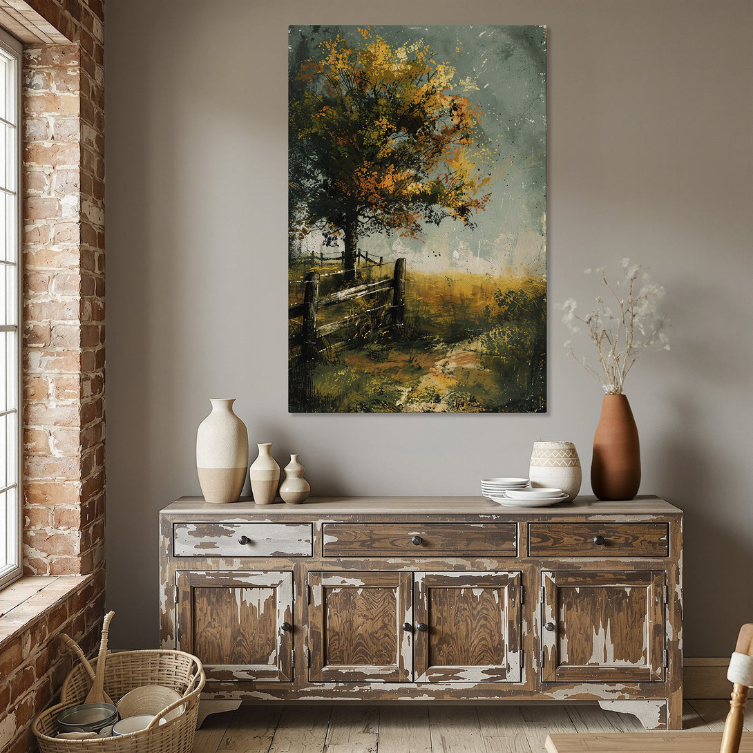 Framed Wall Art featuring a landscape painting with a tree and fence, warm yellow and green tones, perfect for dining room decor.