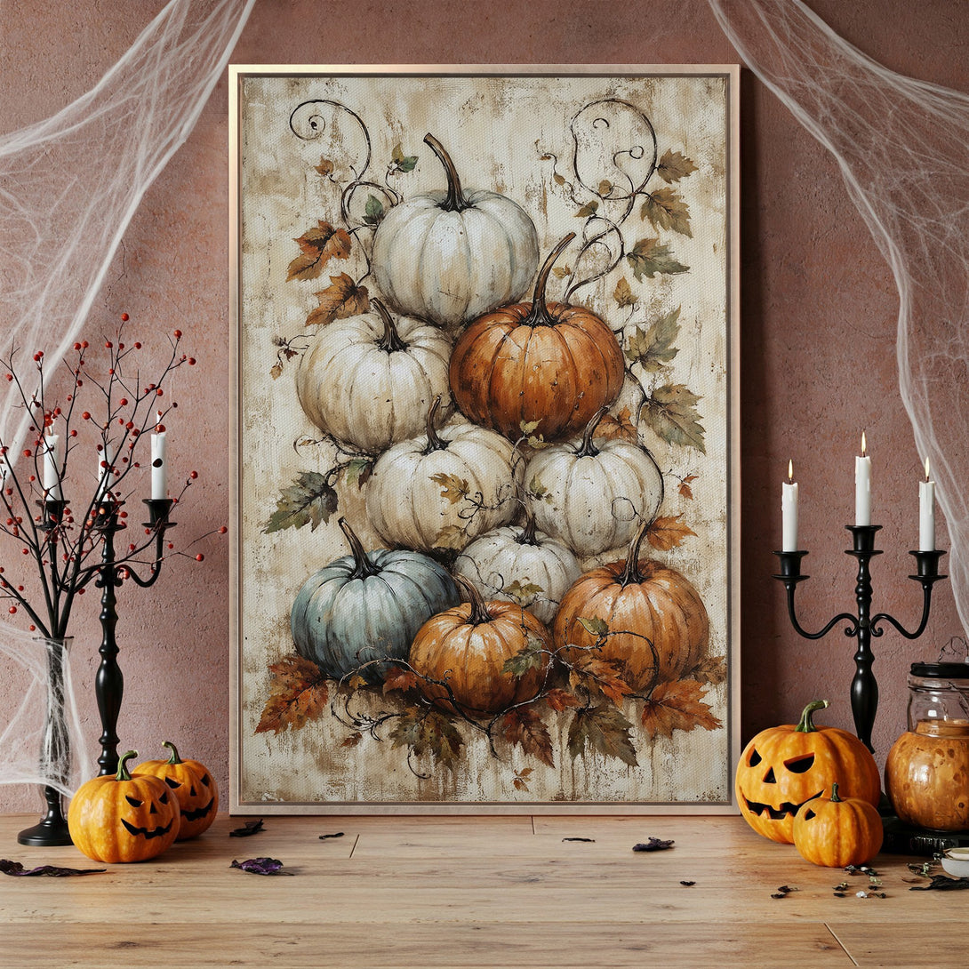 Framed Wall Art featuring a watercolor painting of pumpkins in warm orange, white, and teal tones. Perfect autumn decor for your home!