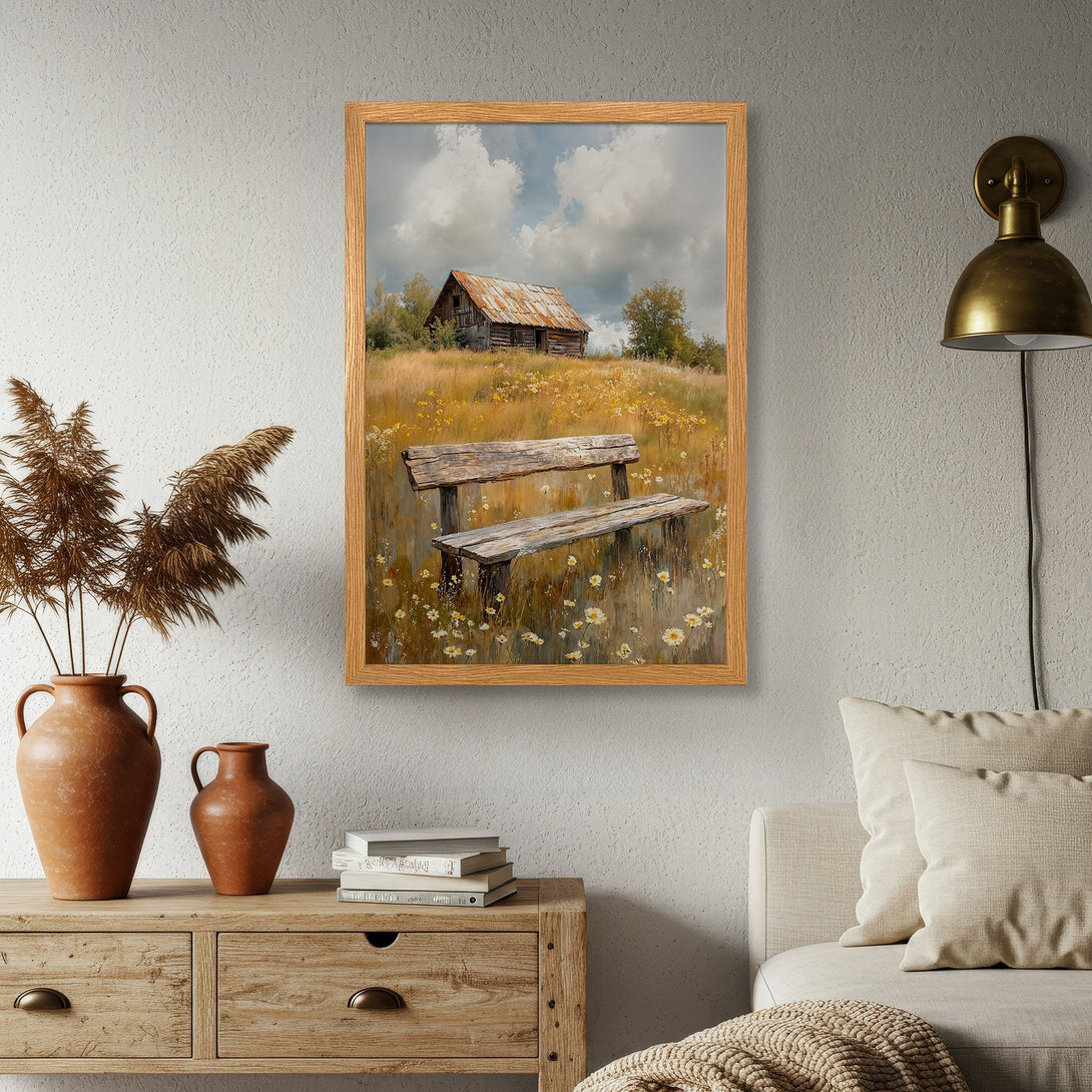 Framed Poster of a rustic landscape with a barn and bench, in warm earth tones. Add a touch of nature to your home!
