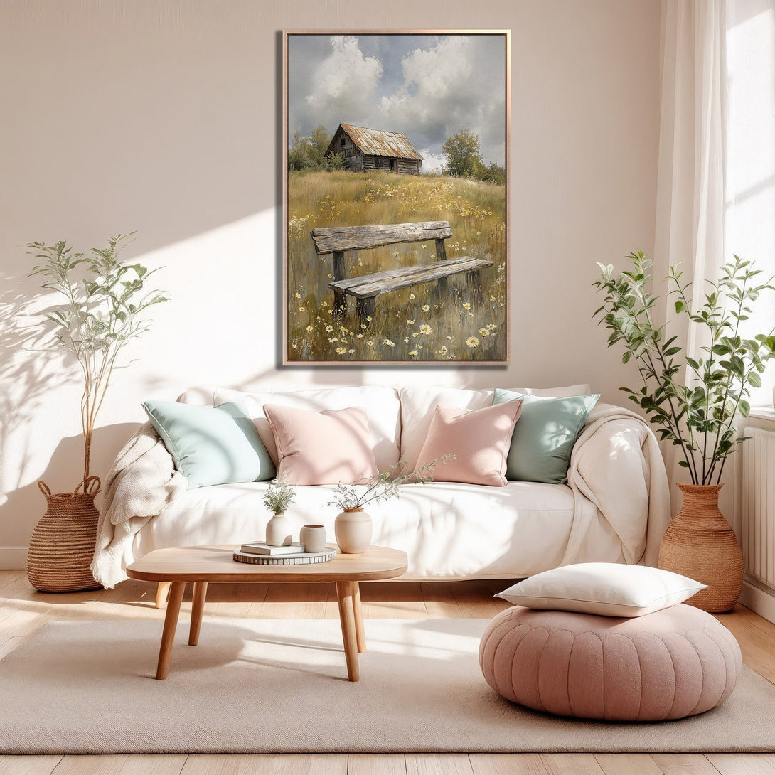 Framed Wall Art: Rustic landscape painting with barn and bench, warm neutral tones, displayed in a cozy living room setting. Perfect home decor accent.